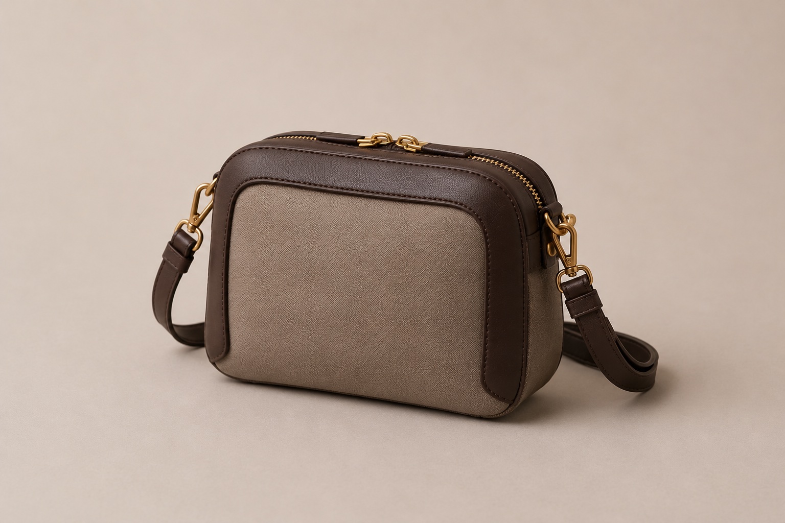 Three-quarter view of the Lumen crossbody showing the solid brass D-ring hardware and adjustable strap.